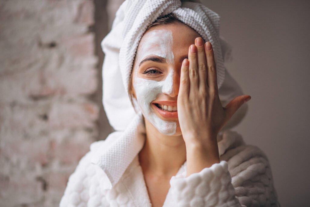 portrait of a woman with a facial mask half face